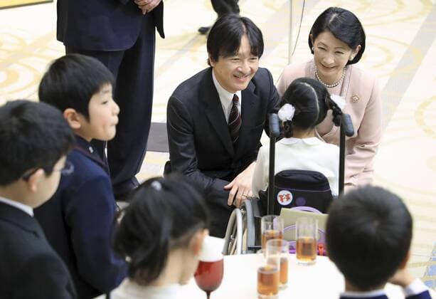 Japanese crown prince, princess at book report contest Japanese Crown Prince Fumihito (facing camera, L) and Crown Princess Kiko (R) talk to the winners of a book report contest for young people in Tokyo on Feb. 7, 2020, following the award ceremony. (Pool photo) 