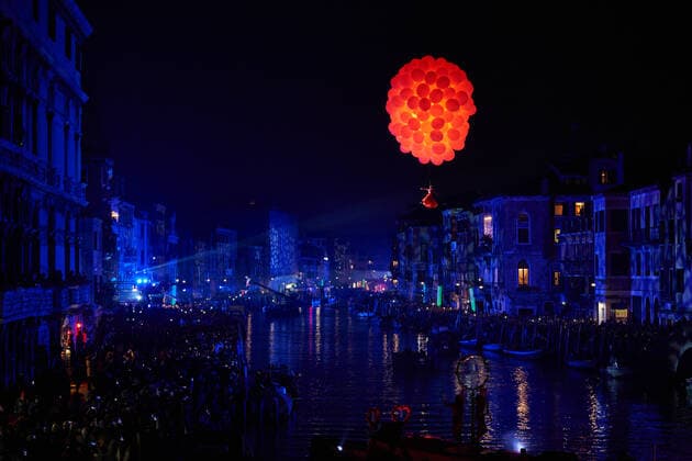 Italy: Venice Carnival 2020 Ballerina with red dress suspended in the air with red balloons during the show Amoris Causa in Venice, Italy. Carnival 2020 opening Venice Venice Italy Venice Copyright: GentianxPolovina