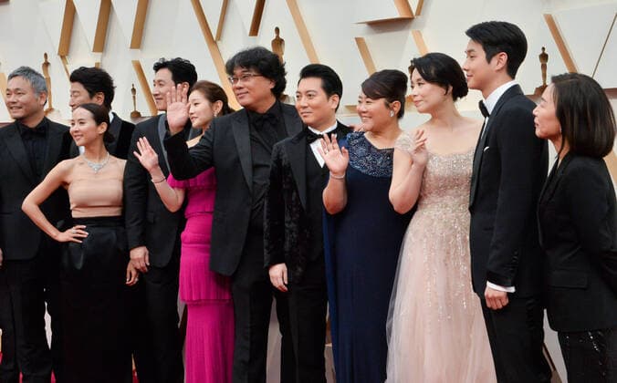 Bong Joon-ho (C) and the cast and crew of Parasite arrive for the 92nd annual Academy Awards at the Dolby Theatre in the Hollywood section of Los Angeles on Sunday, February 9, 2020.  LAP20200209080 JIMxRUYMEN