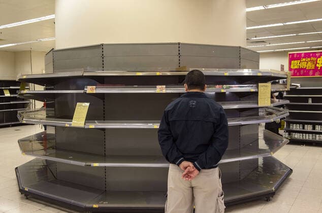 February 12, 2020, Hong Kong, China: A shopper looks at empty supermarket shelves, usually stocked with toilet paper and kitchen rolls. The death toll from the covid-19 coronavirus epidemic past 1, 100 and infected over 45, 000 people worldwide on february 12. Hong Kong China - ZUMAs197 20200212_zaa_s197_107 Copyright: xMiguelxCandelax