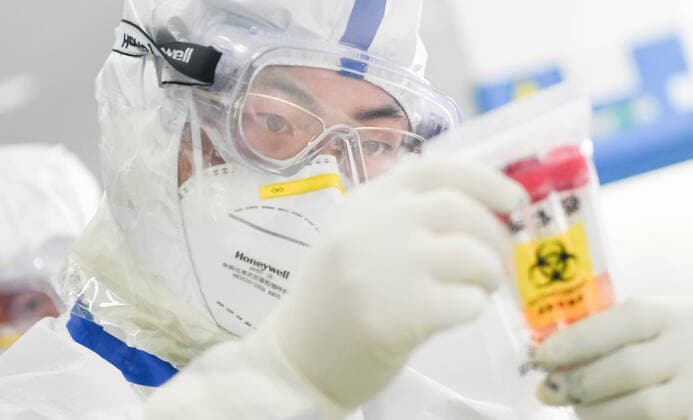 (200213) -- WUHAN, Feb. 13, 2020 -- A staff member works in a laboratory in Wuhan, central China s Hubei Province, Feb. 13, 2020. As a designated service provider of nucleic acid detection of the novel coronavirus, KingMed Diagnostics laboratory in Wuhan conducts non-stop detection service and detects over 2,000 samples from various cities in Hubei Province every day. ) CHINA-HUBEI-WUHAN-NCP-LABORATORY (CN) ChengxMin 