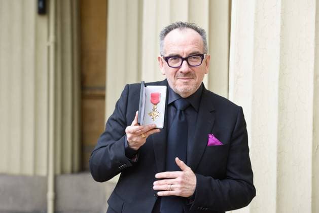 . 14 02 2020. London, United Kingdom. Declan Patrick MacManus, better known by his stage name Elvis Costello, with his OBE for Services to Music after an Investiture at Buckingham Palace in London.  xPoolx xi-Imagesx IIM-20779-0001