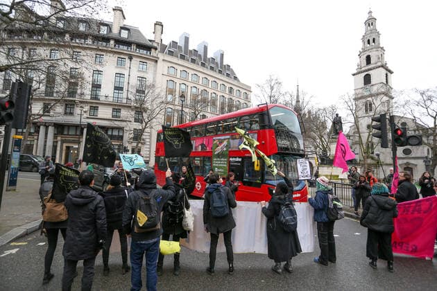 February 15, 2020, London, England, United Kingdom: Extinction Rebellion protesters on the Strand, London as part of a protest against London Fashion Week on Saturday, Feb. 15, 2020. (Photo )..Given the ecological consequences of fast fashion and the impact London Fashion Week has on consumption, the organisation says a boycott is the only way forward to help save our planet..In order to get their message across, the activists will be taking part in several protests during the five-day event in London. London United Kingdom - ZUMAx02_ 20200215_zaf_x02_002 Copyright: xVudixXhymshitix