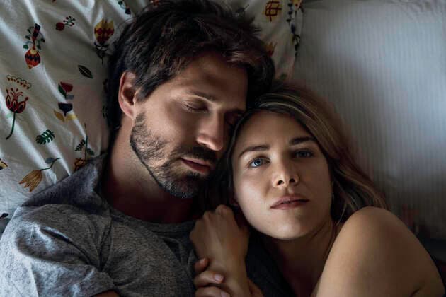Couple sleeping on bed Copyright: FrédéricxCirou B52384830