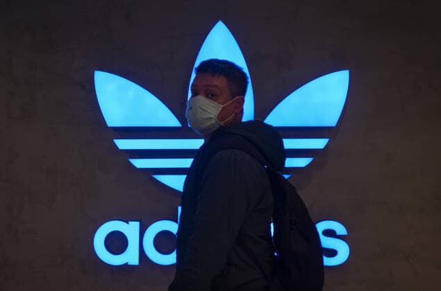 February 11, 2020, Hong Kong, China: A pedestrian walks past the German multinational sportswear clothing brand Adidas logo in Hong Kong. Hong Kong China - ZUMAs197 20200211_zab_s197_034 Copyright: xBudrulxChukrutx