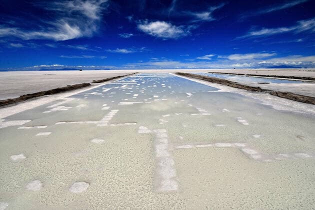 February 13, 2020, Potosi, Bolivia: Bolivian Salar de Uyuni is the world s largest salt flat, and one of the top s bolivian touristic atraction, with 10,582 square kilometers (4,086 sq mi). It is in the province of PotosoÂ­ in southwest Bolivia, near the crest of the Andes at an elevation of 3,656 meters (11,995 ft) above sea level.The crust serves as a source of salt and covers a pool of brine, which is exceptionally rich in lithium. It contains approximatively 50% to 70% of the world s known lithium reserves. However, lithium extraction in the 1980s and 1990s by foreign companies met strong opposition from the local community. Locals believed that the money infused by mining would not reach them. For tourists, it s a point of Rally Dakar and an exceptional landscape. One of the photographic move there since around 15 years is to us - ZUMAl72_ 20200213_znp_l72_015 Copyright: xChristianxLombardix