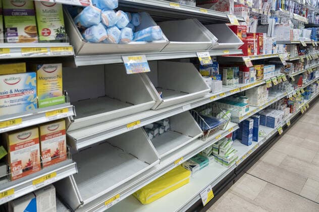 February 23, 2020, Milan, Italy: A view of Empty boxes in a local supermarket..Precautionary measures, as wearing masks, had been taken by citizens and tourists in Milan, for dealing with the fear of being infected by Coronavirus (COVID -19), as more than one hundred confirmed cases had been discovered in north Italy and three old people died. According to a regional decree, many activities (educational, cultural, museum tours) will be suspended until 1st or 2nd March; thus, people reacted with a massive rush to buy water, food supply and soaps. Milan Italy - ZUMAs197 20200223_zaa_s197_248 Copyright: xValeriaxFerrarox
