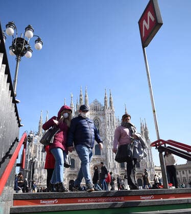 (200224) -- MILAN, Feb. 24, 2020 (Xinhua) -- People wearing masks walk into a subway station in Milan, Italy, on Feb. 24, 2020. Six people have died and 222 have tested positive for the novel coronavirus (COVID-19) nationwide in Italy, Angelo Borrelli, chief of Civil Protection Department and Extraordinary Commissioner for the Coronavirus Emergency, told a press conference at 6 p.m. local time on Monday. (Photo by Daniele Mascolo Xinhua) ITALY-MILAN-COVID-19-CONFIRMED CASES-RISE 