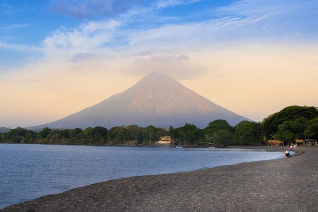 The peak of Concepcion volcano and a black sand beach on Ometepe Island, Lake Nicaragua, Nicaragua, Central America Copyright: AlexxRobinson 1176-1036