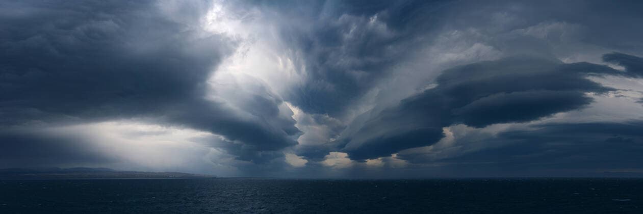 Panorama image of Lenticular clouds over the ocean, Nunavut and Northwest Territories, Canada, North America Copyright: RaulxTouzon 1318-28