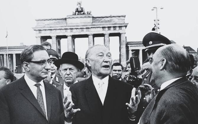 West German Chancellor Konrad Adenauer at Brandenburg Gate, Oct. 31, 1963. Adenauer, was the first Chancellor of the West German Federal Republic, an office he held for 14 years. L-R: Berlin Deputy Mayor Fritz Amrehn; Adenauer; Ernest Lemmer, Minister of For usage credit please use; PUBLICATIONXNOTxINxCANxCHNxFRAxITAxJPNxNORxPOLxRUSxESPxUKxUSA Copyright: xCourtesyxEverettxCollectionx HISL040 EC028