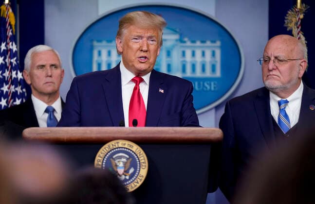 United States President Donald J. Trump, center, holds a press conference to discuss the latest updates about the coronavirus in the Brady Briefing Room at the White House in Washington, DC on February 29, 2020. The first coronavirus-related death in the United States was confirmed in the Seattle area. United States Vice President Mike Pence, left, and Director of the Centers for Disease Control and Prevention Dr. Robert Redfield, right, look on. Copyright: xCNPx xMediaPunchx