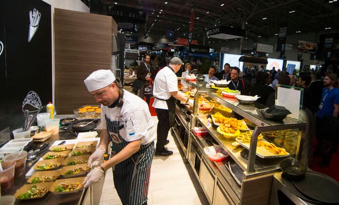 (200301) -- TORONTO, March 1, 2020 -- Chefs prepare food samples during the 2020 Restaurants Canada Show in Toronto, Canada, March 1, 2020. As the largest foodservice and hospitality event in Canada, this annual three-day event kicked off here on Sunday with the latest innovations in food, beverage products and equipments. (Photo by Xinhua) CANADA-TORONTO-RESTAURANTS CANADA SHOW ZouxZheng 