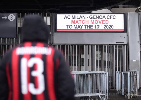 (200302) -- MILAN, March 2, 2020 (Xinhua) -- A fan of AC Milan stands outside the San Siro stadium after a Serie A soccer match between AC Milan and Genoa was postponed due to the recent coronavirus outbreak in Milan, Italy, March 1, 2020. The number of Italians infected by the coronavirus continues to accelerate, Giovanni Rezza, head of the Italian High Institute of Health s Department of Infectious Diseases, said Sunday, adding that the country was at least a week away from seeing a peak in the outbreak. According to Angelo Borrelli, Civil Protection Department chief and Extraordinary Commissioner for the coronavirus emergency, the total number of COVID-19 cases in Italy reached 1,577 -- or 1,694 including those healed or died. (Photo by Alberto Lingria Xinhua) ITALY-MILAN-SERIE A MATCH-POSTPONED 