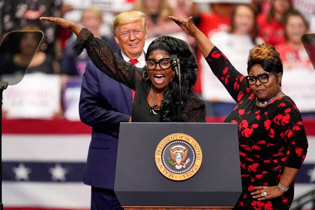 March 2, 2020, Charlotte, North Carolina, USA: LYNNETTE HARDAWAY, left, and ROCHELLE RICHARDSON, American video bloggers known as DIAMOND and SILK, address the crowd as President DONALD TRUMP looks on during a Keep America Great rally at the Bojangles Coliseum in Charlotte, North Carolina on Monday March 2, 2020. 14 states and American Samoa will vote or caucus on Tuesday March 3rd. Their ballots will represent over 33 percent of the national primary totals. Charlotte USA - ZUMAj110 20200302_zsp_j110_038 Copyright: xRustyxJonesx