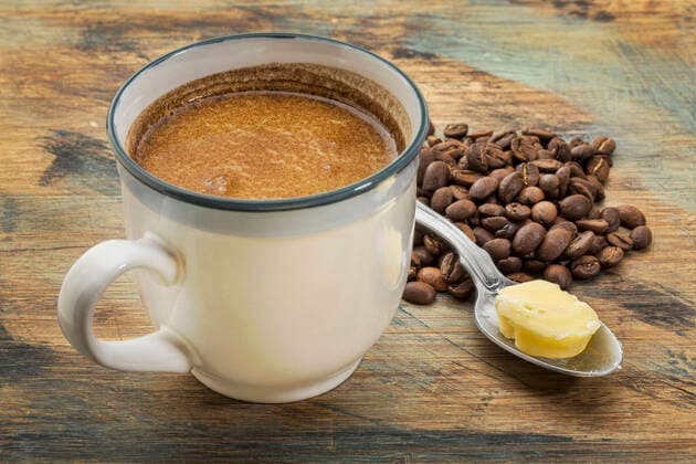 cup of fatty coffee with butter a cup of fresh fatty coffee with butter and coconut oil - ketogenic diet concept  Copyright: xPixelsAwayx 12852294