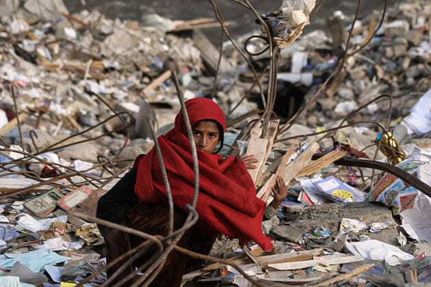 November 12, 2005: A young woman collecting wood to cooking and burn to heat your tent. On October 8, 2005, a magnitude 7.6 earthquake shook the Balakot Kashmir region. Balakot in the North-West Frontier Province was almost completely destroyed. landslides wiped out large numbers of the regions roads, making many of the damaged areas inaccessible to relief workers in the immediate aftermath. In all, more than 80,000 people died as a result of the quake and an estimated 4 million others were left homeless. 11122005. Balakot Kashmir Pakistan. - ZUMAs252 20051112_znp_s252_001 Copyright: xMarcusxSantosx
