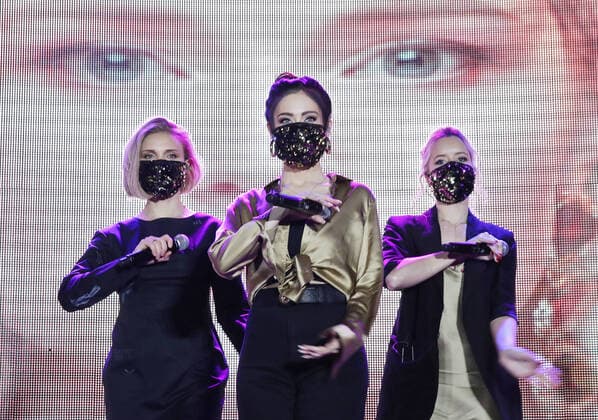 MOSCOW REGION, RUSSIA - MARCH 4, 2020: Members of the Russian pop band Fabrika wearing face masks perform at the pre-party event for the ZHARA Music Awards 2020 ceremony at Moscow s Crocus City Hall. Vyacheslav Prokofyev TASS  TS0D0C4F