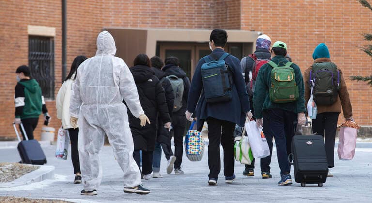 (200305) -- DAEGU, March 5, 2020 -- COVID-19 patients with minor symptoms from Daegu arrive at a special recuperation facility in Chilgok County, South Korea, March 5, 2020. South Korea confirmed 322 more cases of the COVID-19 on Thursday afternoon, raising the total number of infections to 6,088. As of 4:00 p.m. local time, the number of infected patients totaled 6,088, up 322 from the previous announcement as of midnight. Five more deaths were reported, lifting the death toll to 41. (Photo by Lee Sang-ho Xinhua) SOUTH KOREA-COVID-19-CONFIRMED CASES WangxJingqiang 