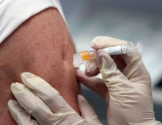 March 7, 2020, Carol Stream, Illinois, USA: Doctor of pharmacy NATASHA PATEL administers an Influenza vaccine at the C.S. Family Pharmacy. The Centers for Disease Control and Prevention recommends everyone 6 months of age and older should get a flu vaccine every season with rare exception. Vaccination is particularly important for people who are at high risk of serious complications from influenza. Carol Stream USA - ZUMA 20200307_mda_bm6_581 Copyright: xH.xRickxBammanx
