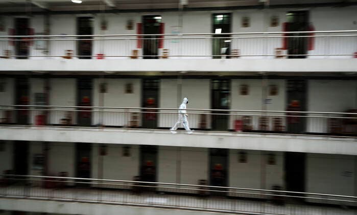 (200312) -- BEIJING, March 12, 2020 -- A volunteer runs on the corridor of a rehabilitation center based in the Wuhan Vocational College of Software and Engineering to deliver meal in Wuhan, central China s Hubei Province, March 11, 2020. The rehabilitation center, converted from the dormitory of the college, is used to host cured coronavirus patients who had been discharged from hospital and were on a 14-day quarantine for medical observation. ) XINHUA PHOTOS OF THE DAY FeixMaohua 