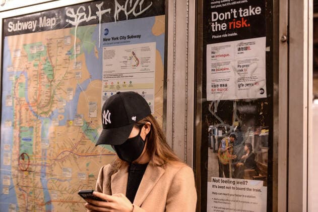 March 13, 2020, New York, Manhattan, USA: A woman riding the subway in NYC. Subway ridership in New York City has plummeted by nearly one million rides a day as the coronavirus outbreak turns into a global pandemic, MTA officials announced Thursday. The subway on Wednesday provided 18.5% fewer rides than the comparable date in March 2019. The system handled 5.39 million staphangers per weekday last March, meaning this weeks dip marks a drop of roughly 996,000 riders.03 123 20. New York Manhattan 57 St station. New York, Manhattan USA - ZUMAs252 20200313_znp_s252_061 Copyright: xMarcusxSantosx