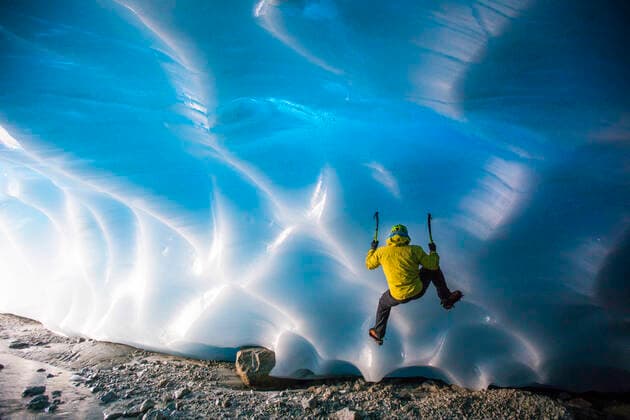 Mountaineer ice climbing on glacial ice in ice cave. Vancouver, BC, Canada ,model released, Symbolfoto CR_JDIP200203-284747-01