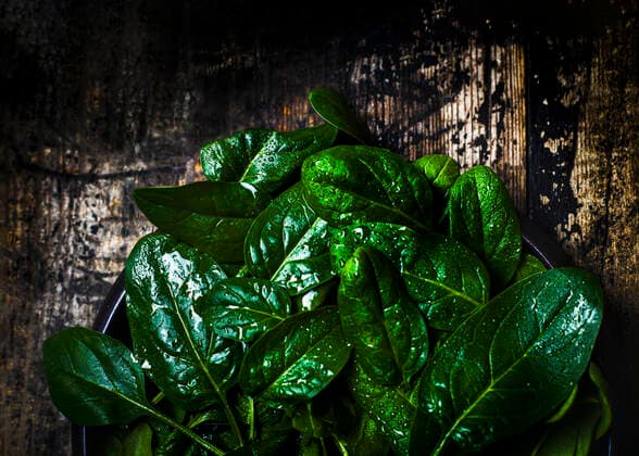 dark and moody image of fresh green organic Spinach room for text London, England, United Kingdom CR_PXAQ200203-306575-01