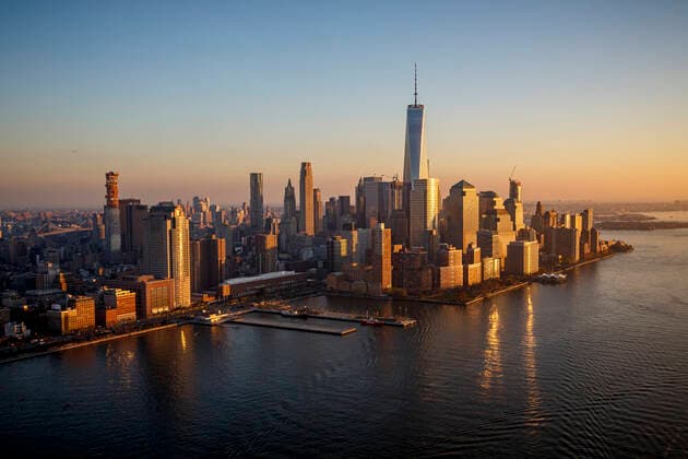 Sunset on Freedom Tower and the Financial District in New York City. New York, NY, United States CR_STBU200212A-294966-01