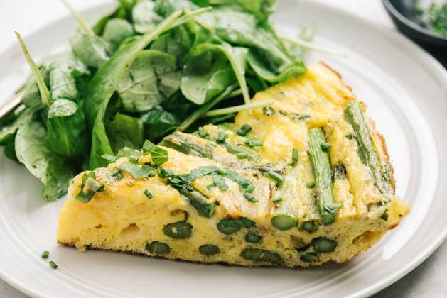 Healthy asparagus frittata meal with arugula salad Frederick, MD, United States CR_EEAV200224A-316391-01