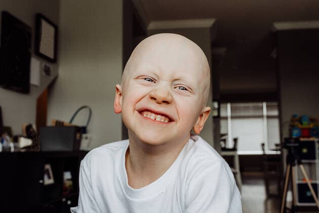 Creative Highlights Symbolfotos Headshot of boy smiling at camera in living room of house Surrey, BC, Canada ,model released, Symbolfoto ,property released CR_HUAS200224B-251446-01