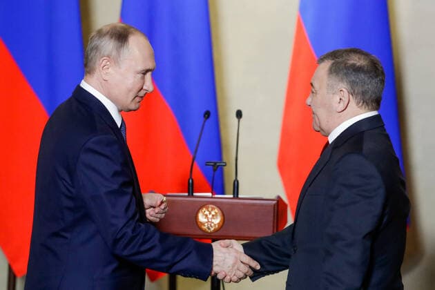 SEVASTOPOL, RUSSIA - MARCH 18, 2020: Russia s President Vladimir Putin (L) awards a Russian Hero of Labour gold star to Stroygazmontazh owner Arkady Rotenberg for the construction of Kerch Strait Bridge, during a ceremony at the Konstantinovskaya Batareya Konstantin Battery Museum and Exhibition Centre. Mikhail Metzel TASS  TS0D2A27