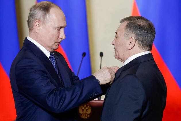 SEVASTOPOL, RUSSIA - MARCH 18, 2020: Russia s President Vladimir Putin (L) awards a Russian Hero of Labour gold star to Stroygazmontazh owner Arkady Rotenberg for the construction of Kerch Strait Bridge, during a ceremony at the Konstantinovskaya Batareya Konstantin Battery Museum and Exhibition Centre. Mikhail Metzel TASS  TS0D2A28