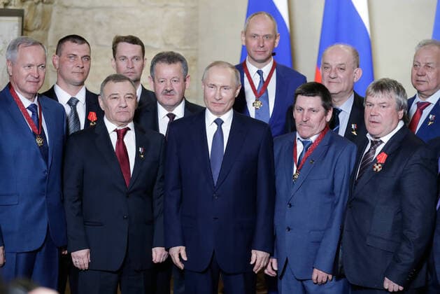 SEVASTOPOL, RUSSIA - MARCH 18, 2020: Russia s President Vladimir Putin (C) poses with participants in a ceremony to present state decorations at the Konstantinovskaya Batareya Konstantin Battery Museum and Exhibition Centre. Mikhail Metzel TASS  TS0D2A2A