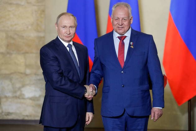 SEVASTOPOL, RUSSIA - MARCH 18, 2020: Russia s President Vladimir Putin (L) awards a Russian Hero of Labour gold star to Kolomna s Mostotryad-125 steel erector Nikolai Zaikov for outstanding professional performance during the construction of Kerch Strait Bridge, during a ceremony at the Konstantinovskaya Batareya Konstantin Battery Museum and Exhibition Centre. Mikhail Metzel TASS  TS0D2A2B