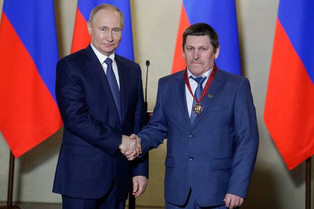 SEVASTOPOL, RUSSIA - MARCH 18, 2020: Russia s President Vladimir Putin (L) awards an Order for Merits to the Fatherland 3rd class to Cheboksary s Mostotryad-41 welder Dmitry Gavrilov for outstanding professional performance during the construction of Kerch Strait Bridge, during a ceremony at the Konstantinovskaya Batareya Konstantin Battery Museum and Exhibition Centre. Mikhail Metzel TASS  TS0D2A29
