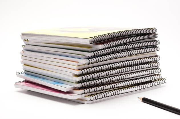 notebooks A pile of notebooks with pen  Copyright: xalexkosevx 123527