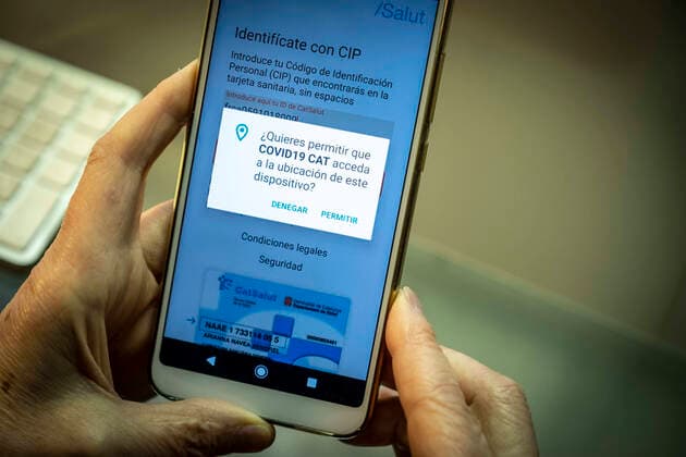 March 19, 2020, Barcelona, Catalonia, Spain: In this photo illustration a mobile phone displaying the SARS-COV-2 symptom tracking mobile app..The Health Department of the Generalitat of Catalunya has made available to citizens an app for monitoring and surveillance of the symptoms of the SARS-COV-2 coronavirus. Barcelona Spain - ZUMAs197 20200319_zaa_s197_166 Copyright: xPacoxFreirex