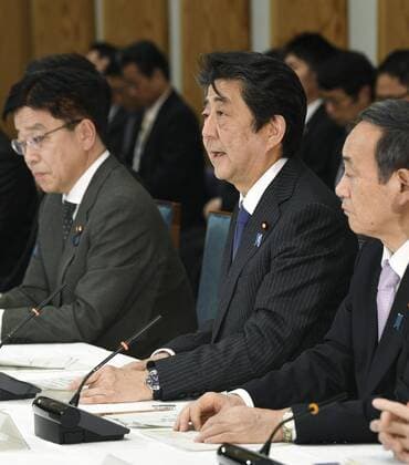 New coronavirus Japanese Prime Minister Shinzo Abe (C) speaks during a meeting on the coronavirus crisis on March 20, 2020, in Tokyo. 