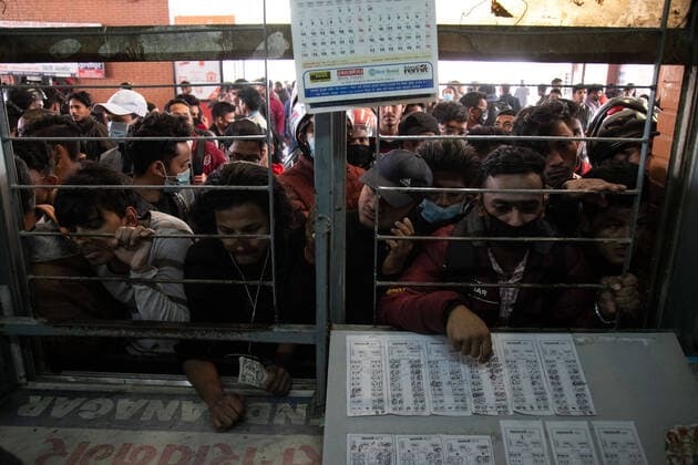 March 28, 2020, Kathmandu, Nepal: People gather at a ticket counter to buy bus tickets amid Coronavirus threats..Nepalese government decided to close down public places such as schools, movie theatres, night clubs, Health clubs, cultural centres and Sports zone, from 19 March to 30 April 2020 as part of precautionary measures against the spread of the corona virus Covid-19. Kathmandu Nepal - ZUMAs197 20200328_zaa_s197_004 Copyright: xPrabinxRanabhatx