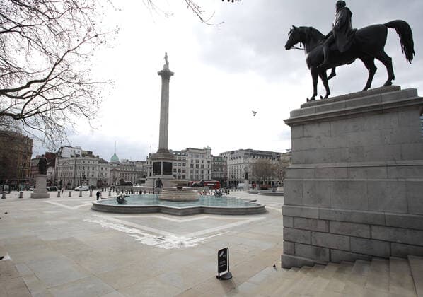 An almost deserted Trafalgar Square at 1.37pm as many tourists and sightseers seem to have not ventured out. The COVID-19 Coronavirus pandemic crisis continues, and although there is no lockdown in London, some changes to public transport have been made as there seems to be fewer people and tourists moving around the city. COVID-19 Coronavirus crisis, London, UK on March 20, 2020 