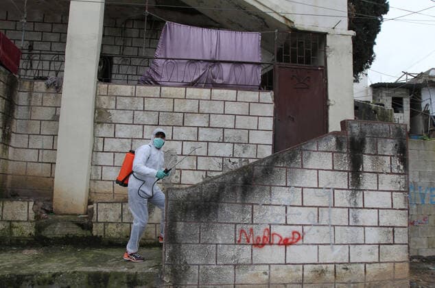 (200320) -- TRIPOLI, March 20, 2020 (Xinhua) -- A volunteer disinfects houses as a precautionary measure against the COVID-19 epidemic at a community in Tripoli, Lebanon, March 20, 2020. Lebanon s Health Ministry announced on Friday that the number of COVID-19 cases in the country has increased to 163, the National News Agency reported. (Photo by Khalid Xinhua) LEBANON-TRIPOLI-COVID-19-VOLUNTEER 
