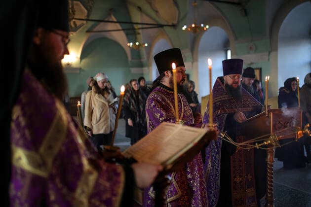 MOSCOW, RUSSIA - MARCH 20, 2020: Priests during an evening service at the Vysokopetrovsky Monastery. Starting from March 18 monks conduct a religious procession and spray holy water after the evening service at the monastery amid the coronavirus pandemic. Sergei Bobylev TASS  TS0D2ED6
