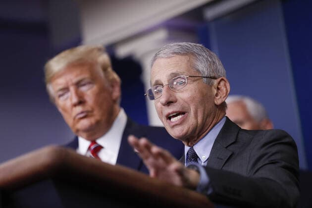 Anthony Fauci, director of the National Institute of Allergy and Infectious Diseases, speaks as U.S. President Donald Trump, left, and U.S. Vice President Mike Pence, right, listen during a Coronavirus Task Force news conference in the briefing room of the White House in Washington, DC on Friday, March 20, 2020. Americans will have to practice social distancing for at least several more weeks to mitigate U.S. cases of Covid-19, Anthony S. Fauci of the National Institutes of Health said today. WAX20200320931 ALxDRAGO