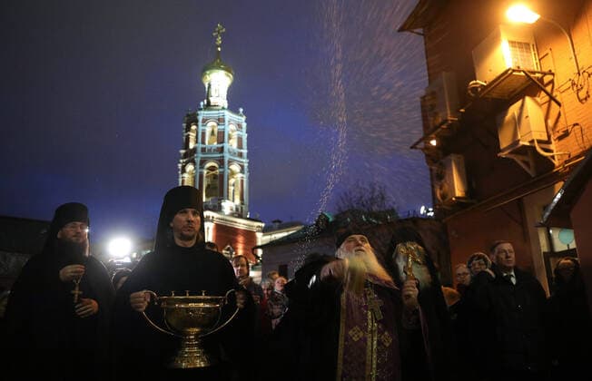 MOSCOW, RUSSIA - MARCH 20, 2020: Priests during a religious procession at the Vysokopetrovsky Monastery. Starting from March 18, monks conduct a religious procession and spray holy water after the evening service at the monastery amid the coronavirus pandemic. Sergei Bobylev TASS  TS0D2EDF