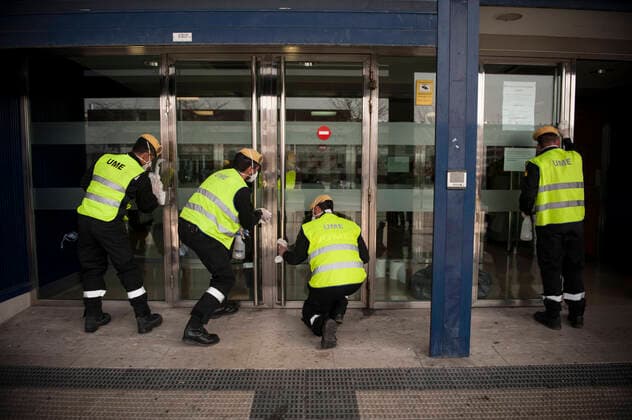 March 20, 2020, Pamplona, Navarra, Spain: Members of the Spanish Military Emergency Unit, carrying out disinfection tasks at the Pamplona Immigration Office..A total of four self-bomb trucks and 15 military personnel wearing protective equipment continue the disinfection work entrusted to the Spanish Military Emergency Unit by the Ministry of Interior, in areas that could have been infected with the coronavirus Pamplona Spain - ZUMAs197 20200320_zaa_s197_096 Copyright: xElsaxAxBravox
