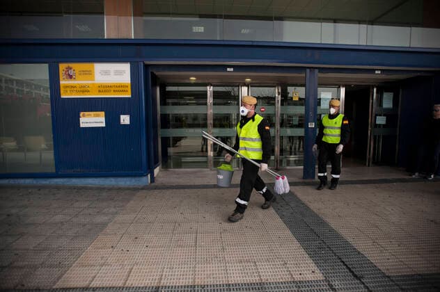 March 20, 2020, Pamplona, Navarra, Spain: Members of the Spanish Military Emergency Unit, carrying out disinfection tasks at the Pamplona Immigration Office..A total of four self-bomb trucks and 15 military personnel wearing protective equipment continue the disinfection work entrusted to the Spanish Military Emergency Unit by the Ministry of Interior, in areas that could have been infected with the coronavirus Pamplona Spain - ZUMAs197 20200320_zaa_s197_103 Copyright: xElsaxAxBravox