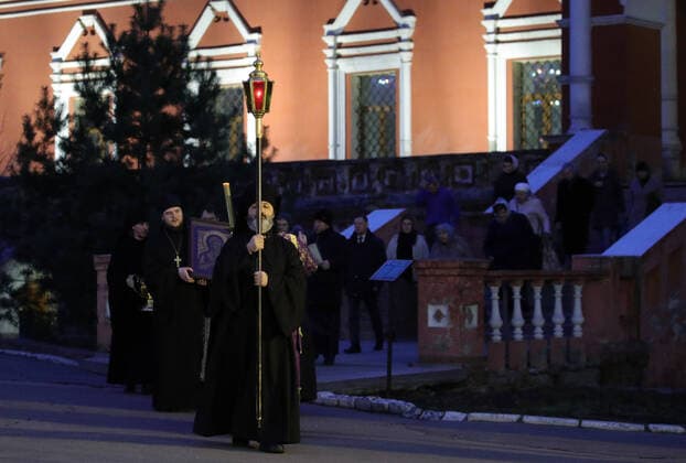 MOSCOW, RUSSIA - MARCH 20, 2020: Priests during an evening service at the Vysokopetrovsky Monastery. Starting from March 18, monks conduct a religious procession and spray holy water after the evening service at the monastery amid the coronavirus pandemic. Sergei Bobylev TASS  TS0D2EEC
