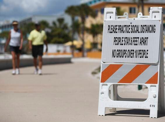 March 20, 2020, St. Petersburg, Florida, USA: A sign to encourage social distancing is out along the walking path at Treasure Island Beach Beach on Friday, March 20, 2020 in St. Petersburg. Pinellas County has announced that all public beaches will close tonight at 11:59 p.m. St. Petersburg USA - ZUMAs70_ 20200320_zan_s70_029 Copyright: xDirkxShaddx