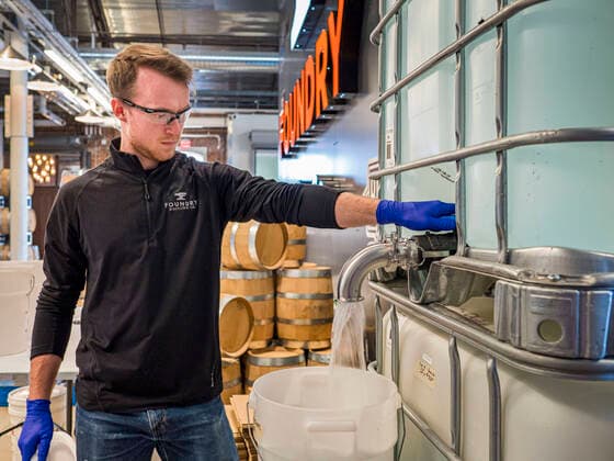 March 20, 2020, Des Moines, Iowa, U.S: GREG BIAGI, the distiller at the Foundry, a Des Moines distiller, pours hand sanitizer into a 5 gallon jug. The distillery suspended its distilling operations to make hand sanitizer this week. They distributed it free to people who came to their building. On Friday thousands of people came to get some. There line was more than one mile long. On Friday morning, 20 March, Iowa reported 45 confirmed cases of the Coronavirus. Restaurants, bars, movie theaters, places that draw crowds are closed for at least 30 days. There are no shelter in place orders in effect anywhere in Iowa but people are being encouraged to practice social distancing and many businesses are requiring or encouraging employees to telecommute. Des Moines U.S. - ZUMAk94_ 20200320_zaf_k94_010 Copyright: xJackxKurtzx